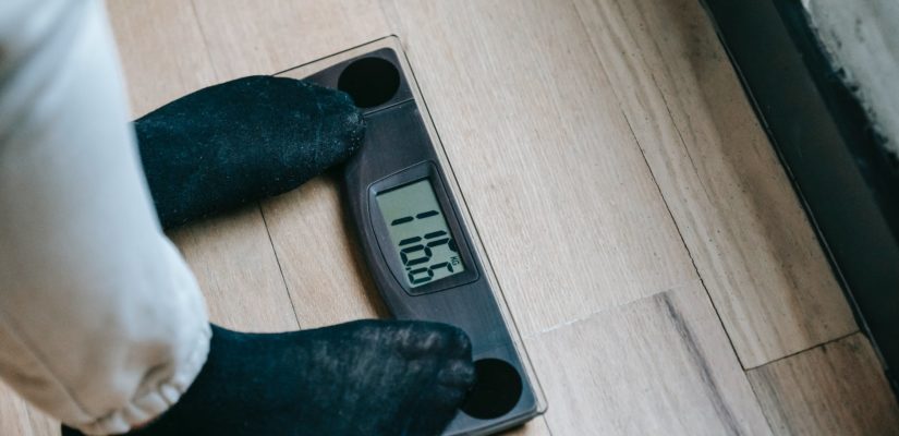 crop person on weight scales