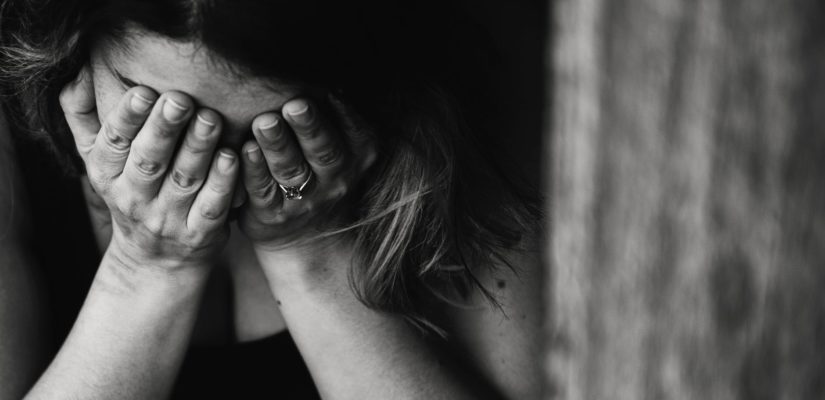 grayscale photography of crying woman